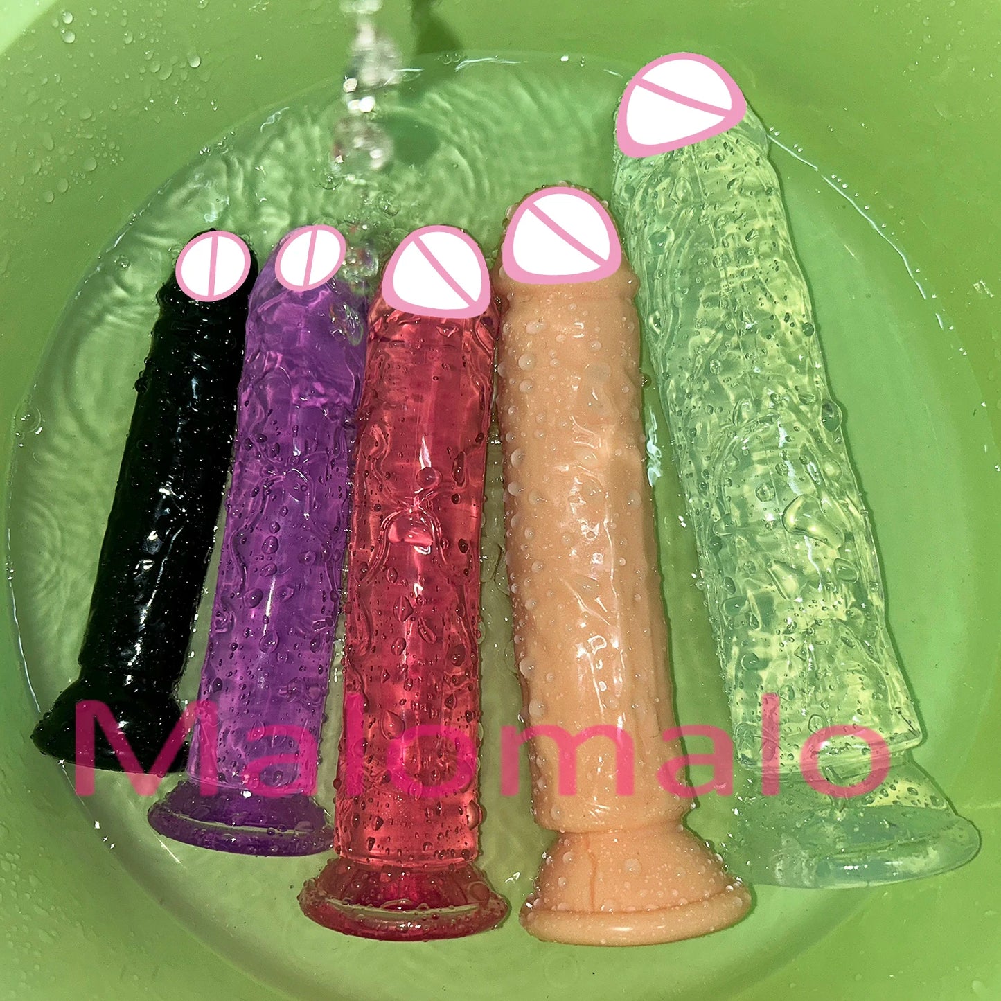 Transparent jelly sex toys with suction bases in black, purple, red, flesh, and translucent green