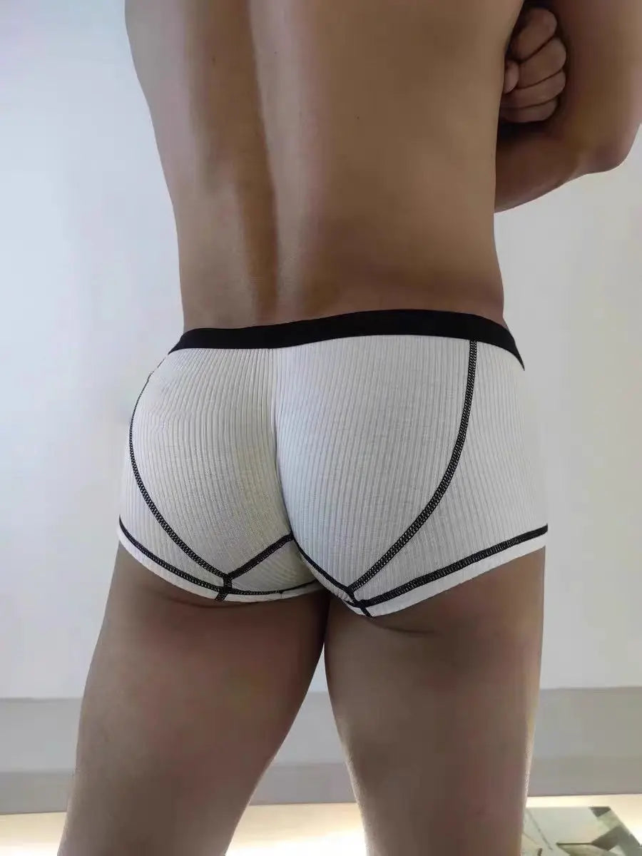 White ribbed boxer shorts with black waistband and black side seam panels.