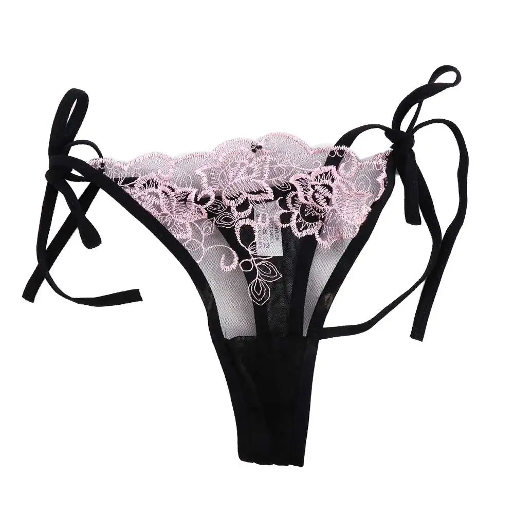Embroidered lace panty brief in pink lace over black with sheer sides and tie bows