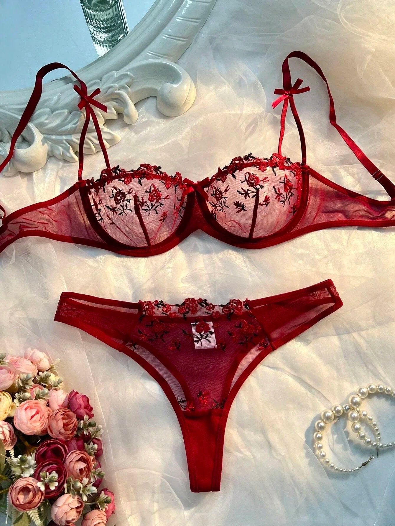 Red sheer lace floral bra and matching thong set with bow straps