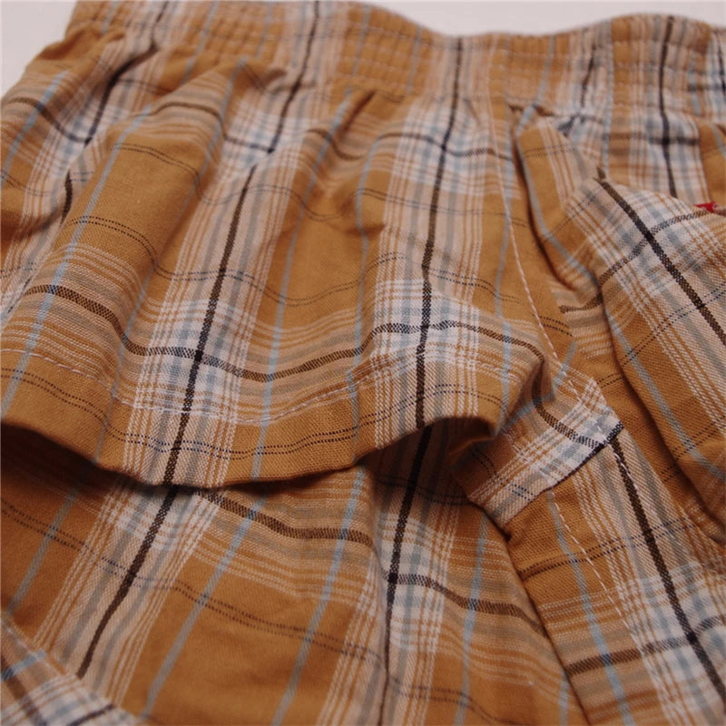 Plaid cotton boxer brief waistband and plaid pattern detail in tan/orange tones