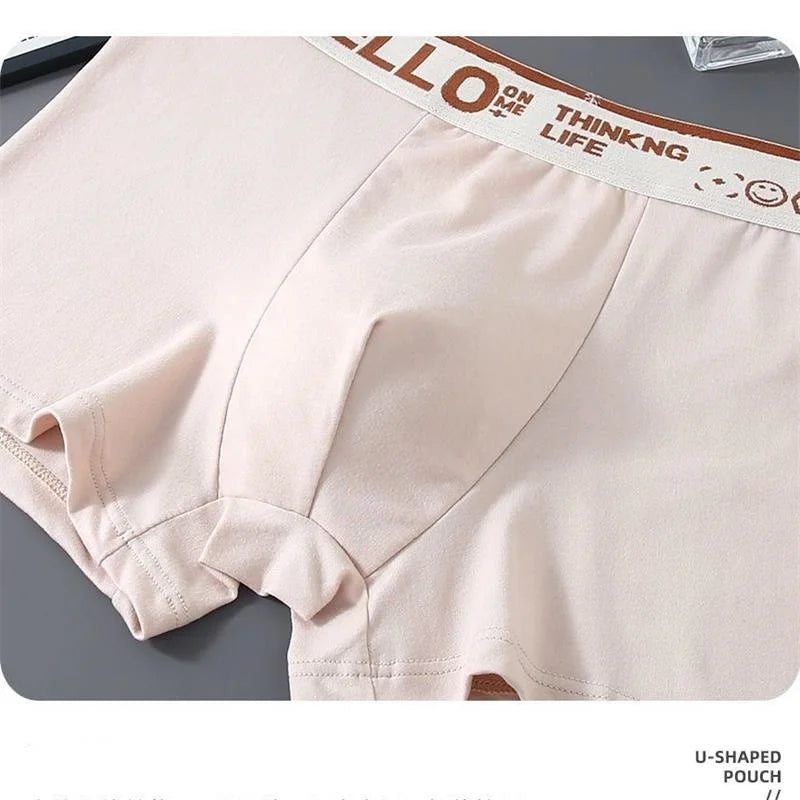 Cream seamless boxer briefs with “HELLO” waistband and smooth front seam