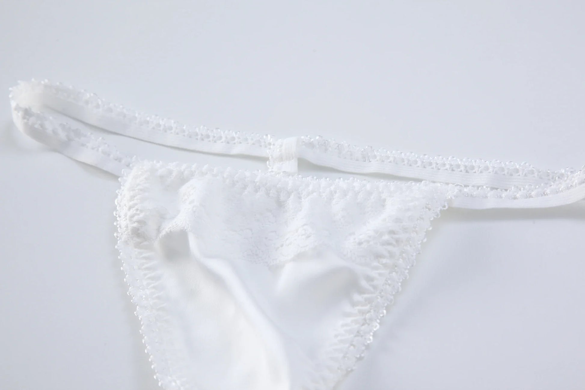 White triangle lace backless bodysuit bottom with elastic leg openings