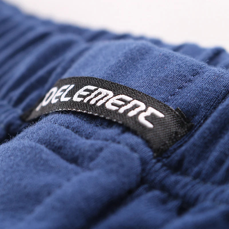 Cotton fabric close-up with ROEELEMENT logo on the waistband