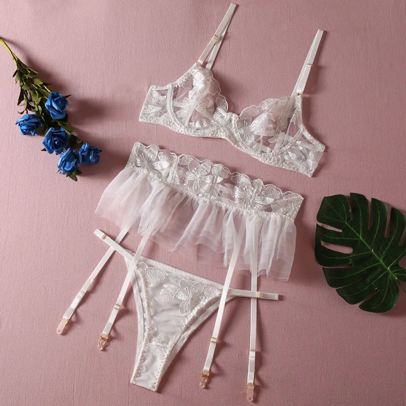 White embroidered mesh lingerie set with strappy bra, sheer skirt, thong and garter straps