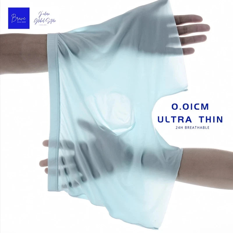 Light blue seamless boxer briefs on a hand, showing smooth front and leg openings