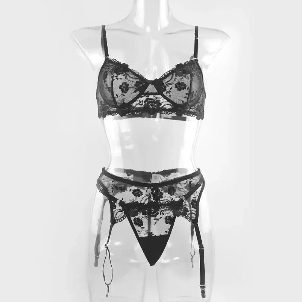 Black lace push-up bra with floral embroidery and matching garter panty set