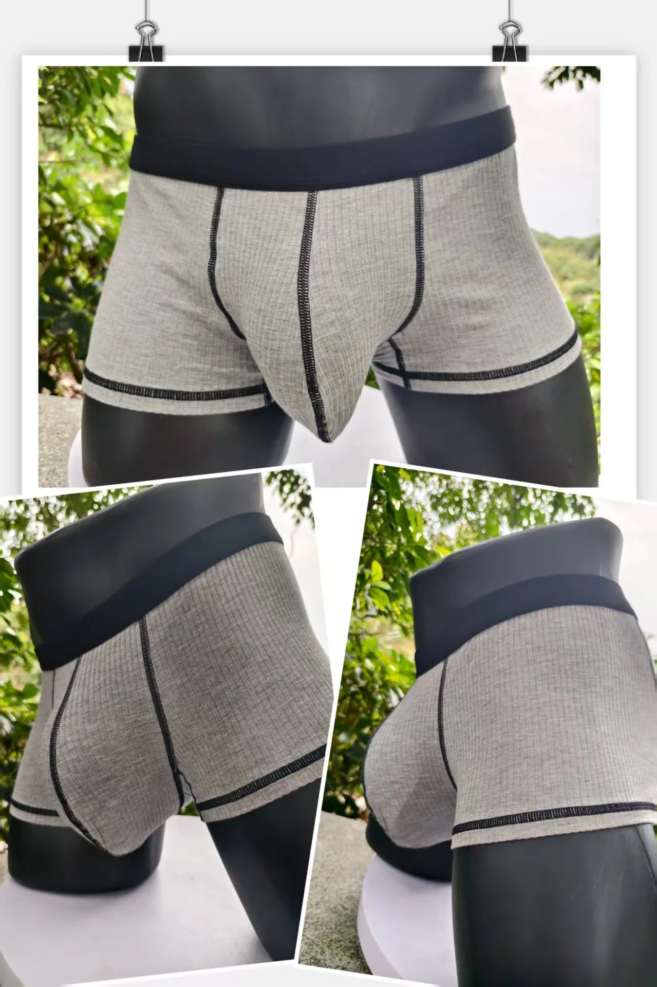 Light gray ribbed boxer shorts with black waistband and contrast seam trim.