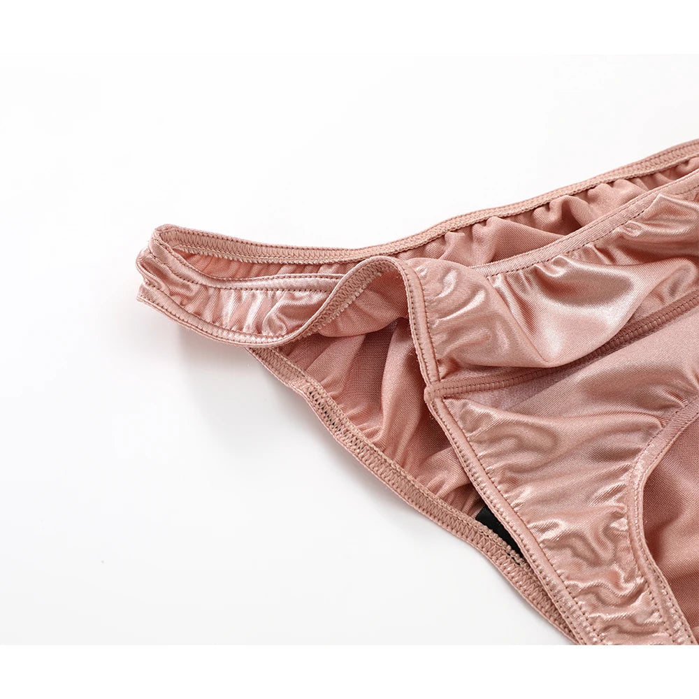 Peach satin silky thong-style brief, ruched fabric and elastic waistband, close view