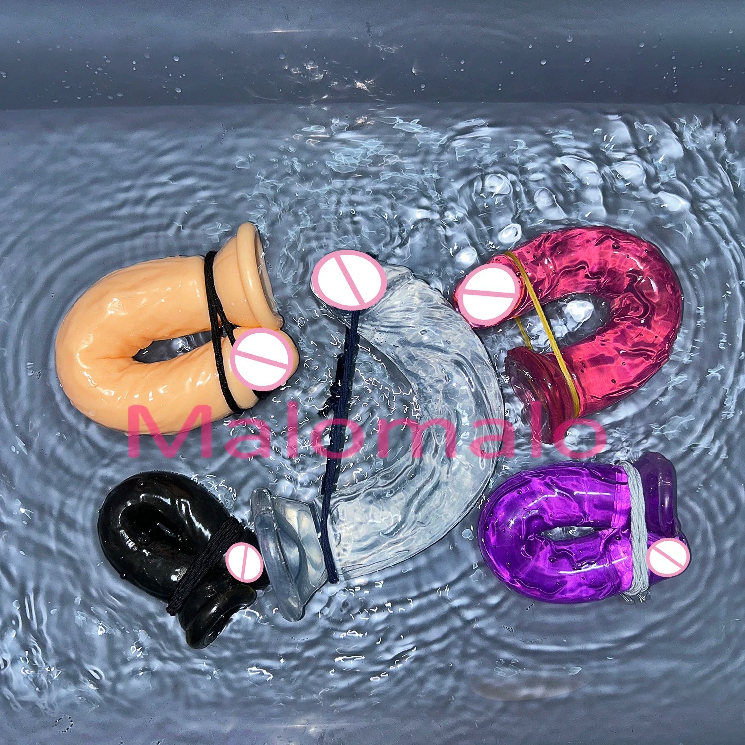 Set of transparent jelly sex toys with suction bases in flesh, black, purple, and magenta