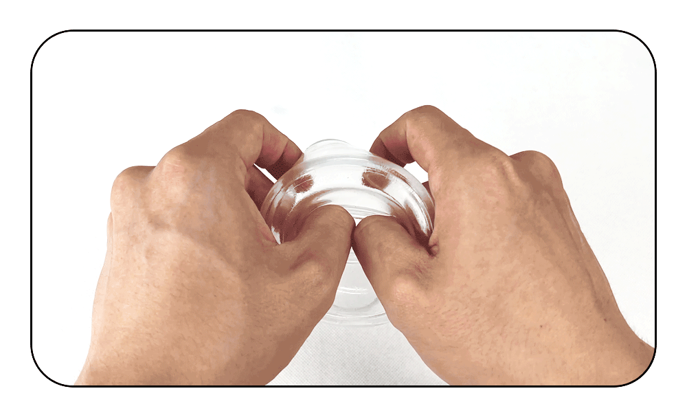 Electric suction pump with clear suction chamber held by hands