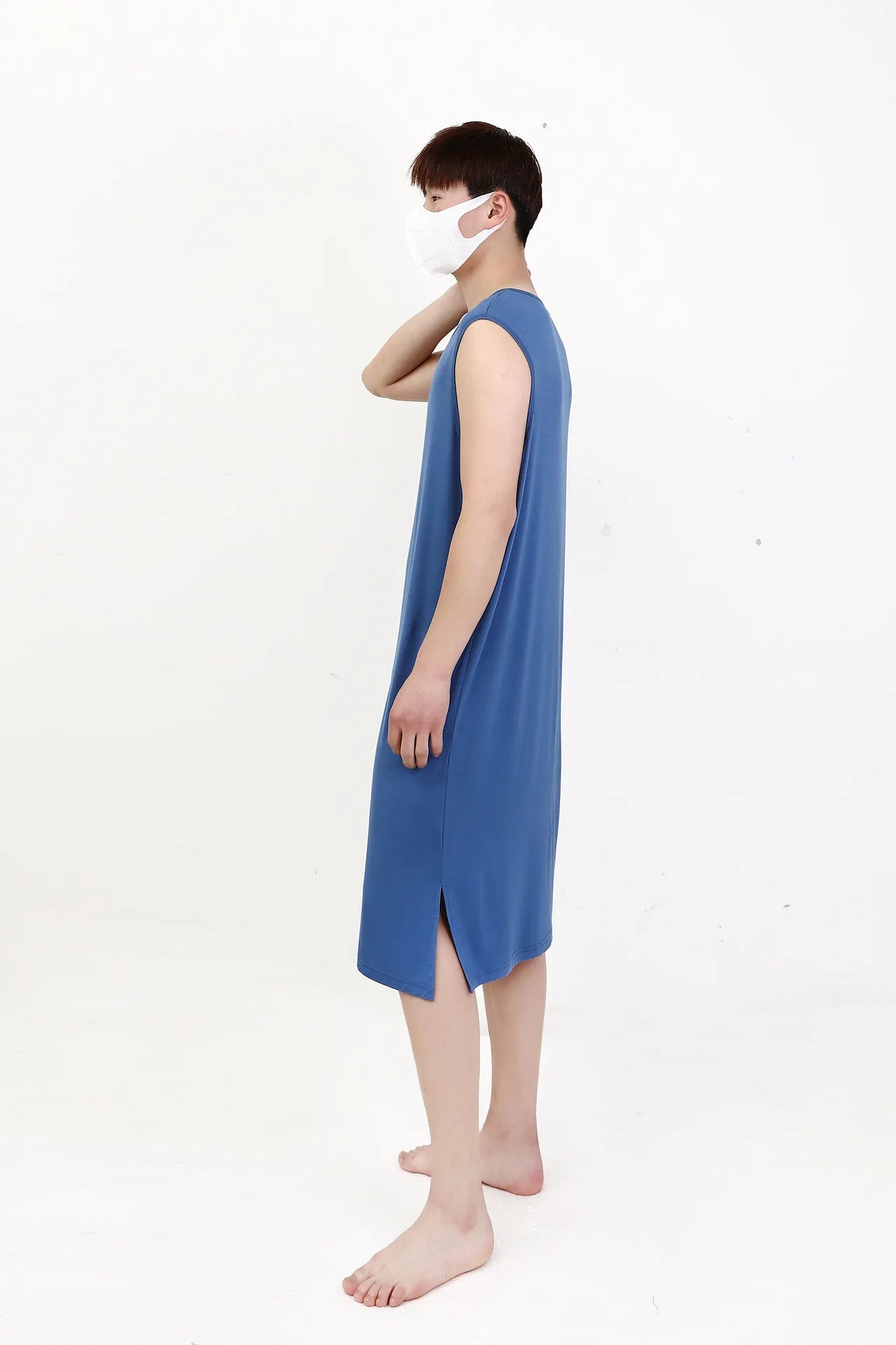 Blue sleeveless sleepwear vest dress, side view on model