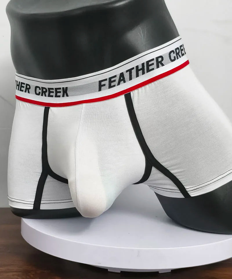 White sports boxer shorts with black side panels and contoured front pouch