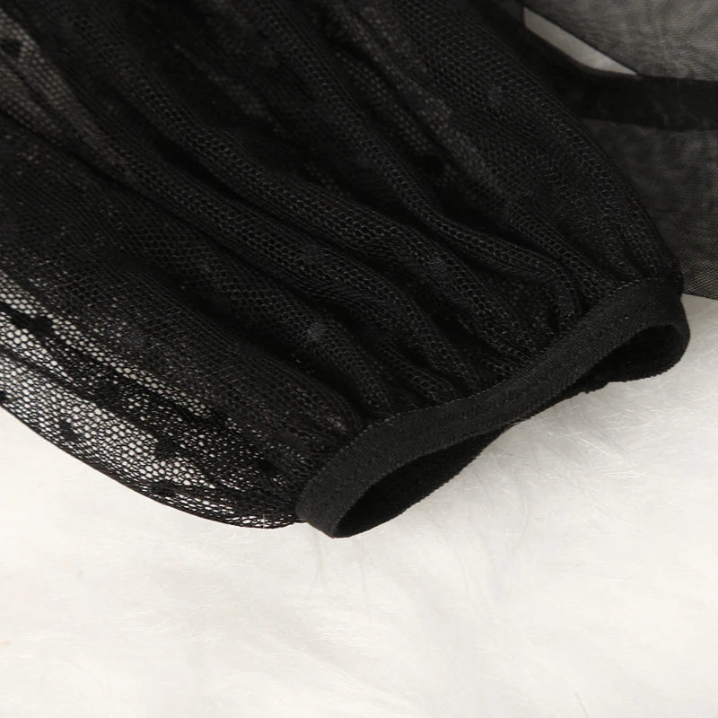 Black lace robe hem with scalloped mesh edge and gathered ruffle trim