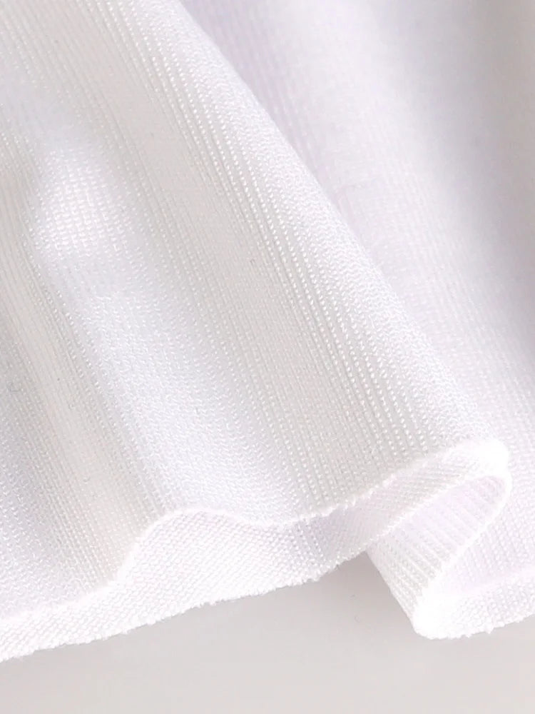 Close-up of white seamless fitness vest fabric and armhole opening