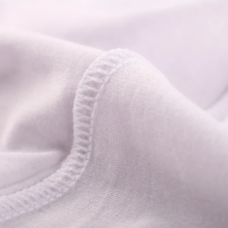 White boxer brief fabric close-up with stitched hem and elastic trim